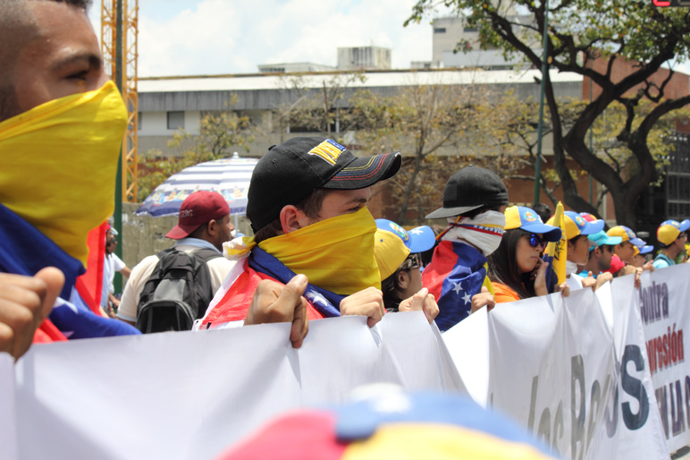 Venezuelans protest in the street against the government for human rights violations and killings of civilians in peaceful demonstrations 2014 shutterstock 182109113