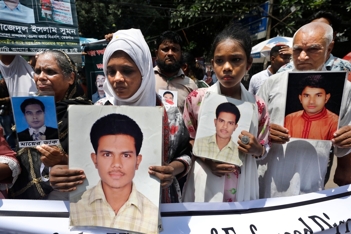 To mark the International Day of the Victims of Enforced Disappearances the relatives of missing people formed a human chain in Dhaka Bangladesh on 30 August 2022 Shutterstock
