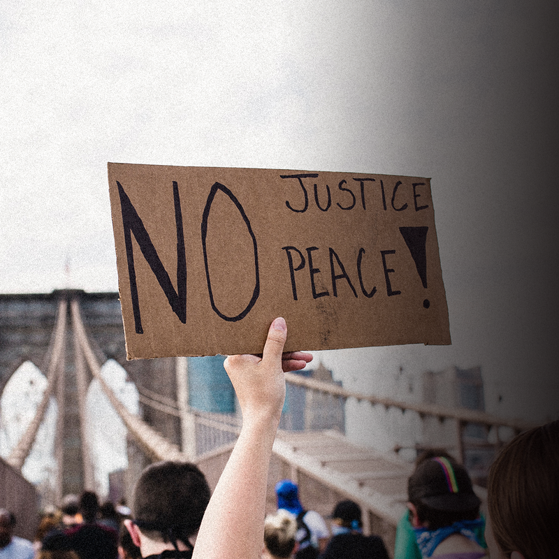 Hero Seeking Justice Pexels Protester Holding A Sign Life Matters2020 Pexels